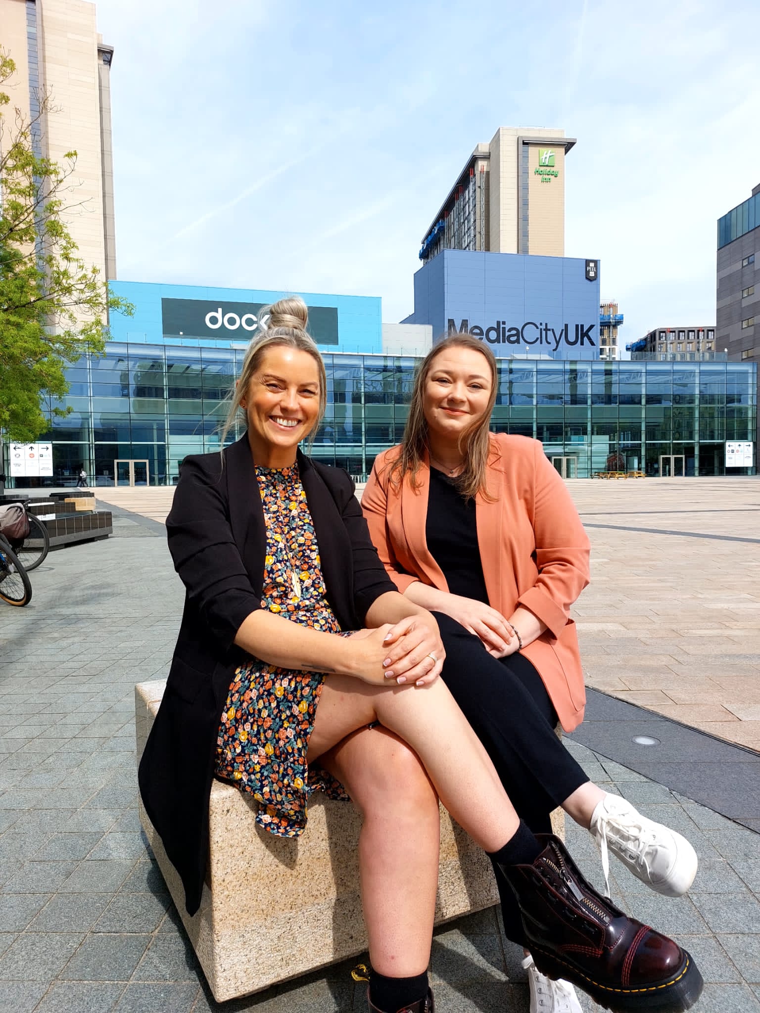 Stacey and Charlotte sat by the BBC at Media City